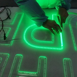 Green neon letter